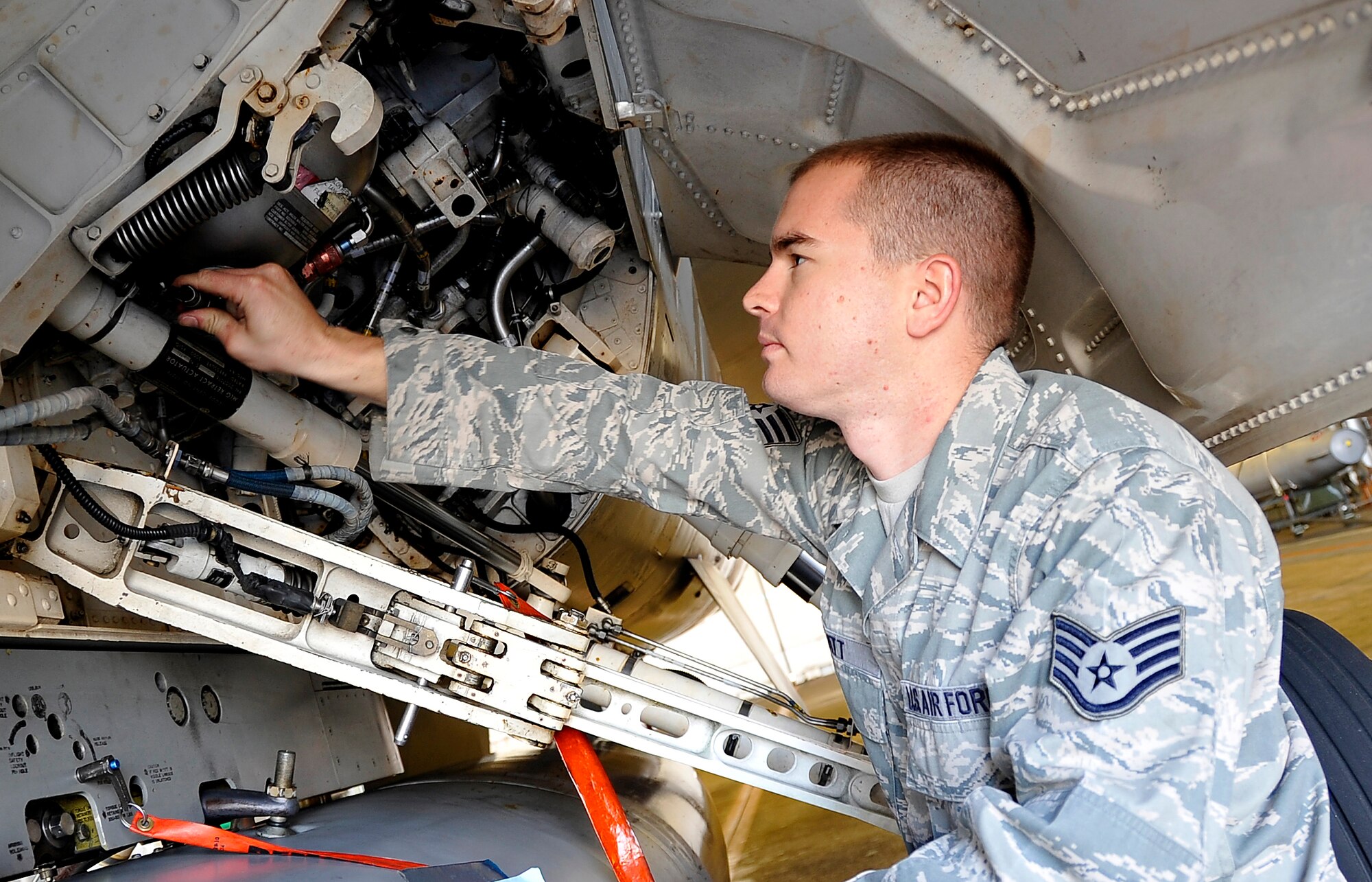MISAWA AIR BASE, Japan -- Staff Sgt. Michael Pratt, 14th Fighter Squadron crew chief, performs maintenance on an F-16 Fighting Falcon Oct. 22. Every crew chief is assigned one aircraft. (U.S. Air Force photo/Staff Sgt. Chad C. Strohmeyer)