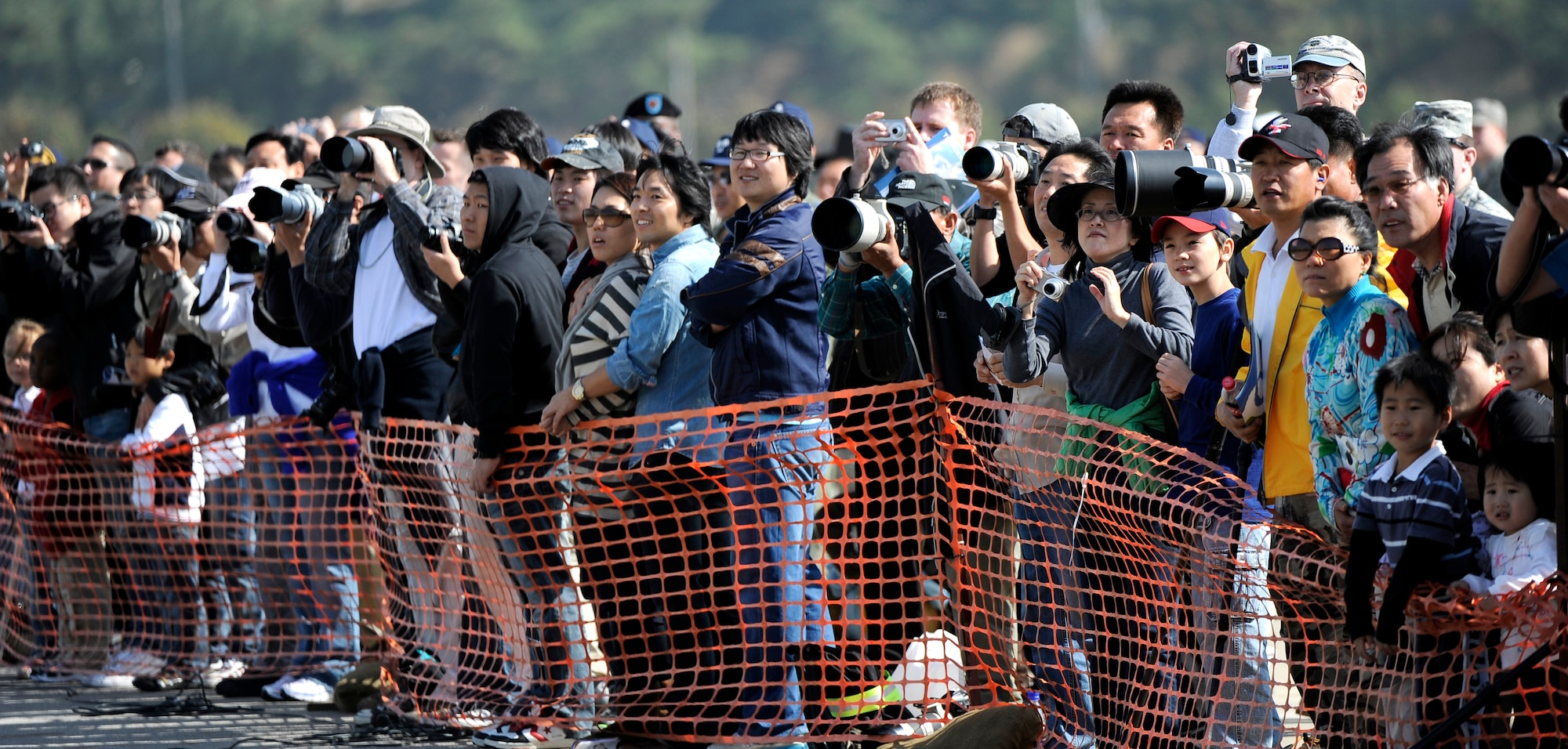 Spectators use video and still cameras to shoot the many aerial demonstrations during Air Power Day 2009 at Osan Air Base, Republic of Korea, Oct. 21. (U.S. Air Force photo/Staff Sgt. Brian Ferguson)





