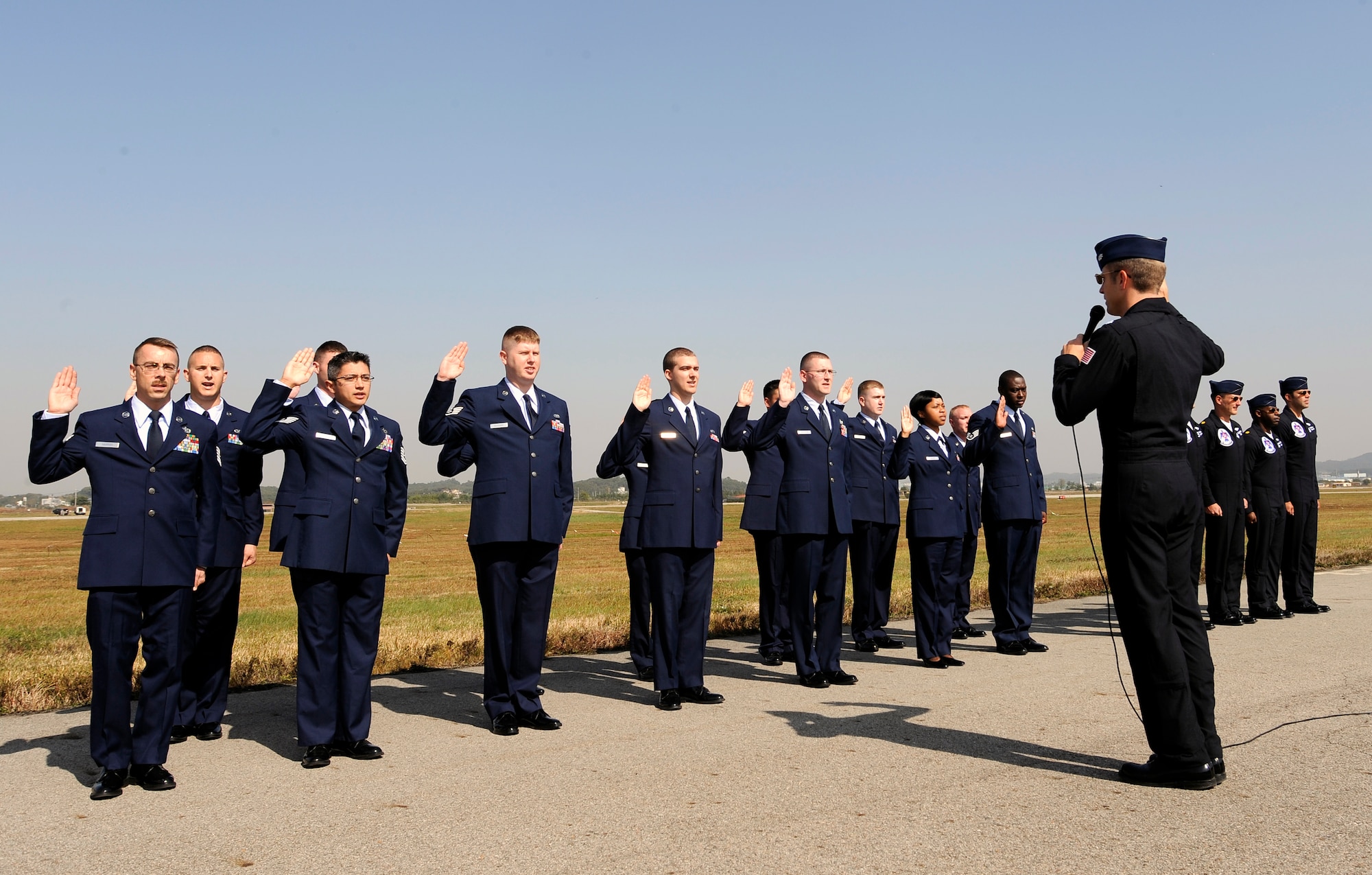 U.S. Air Force Thunderbird Commander Lt. Col. Greg Thomas reenlists 14 Airmen stationed in the Republic of Korea during Air Power Day 2009 at Osan Air Base Oct. 21. (U.S. Air Force photo/Staff Sgt. Brian Ferguson)






