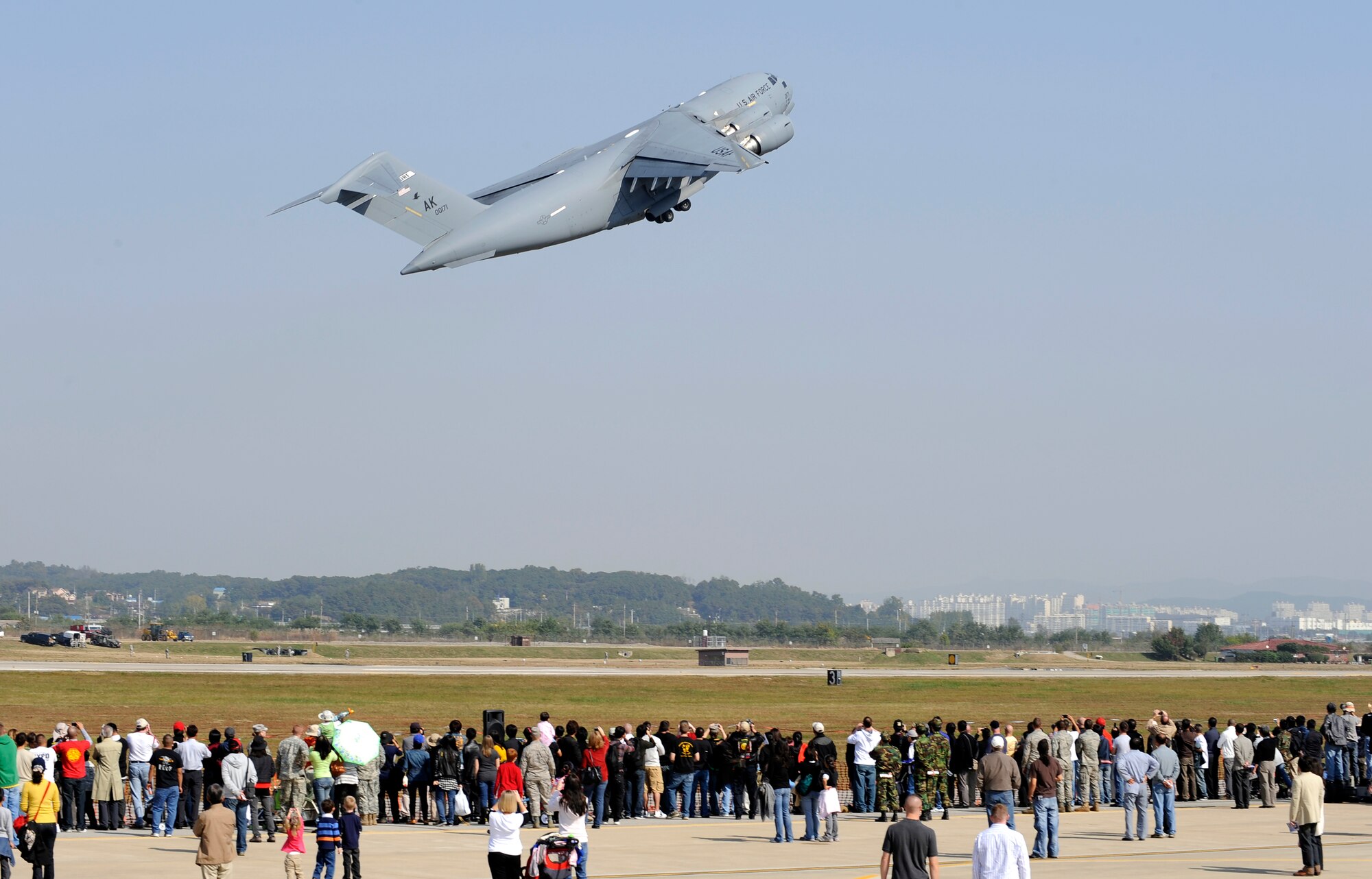 A C-17 Globemaster III from Elmendorf AFB, Alaska, takes off from the Osan Air Base, Republic of Korea, flightline to perform an aerial demonstration during Air Power Day 2009, Oct. 21. (U.S. Air Force photo/Staff Sgt. Brian Ferguson)




