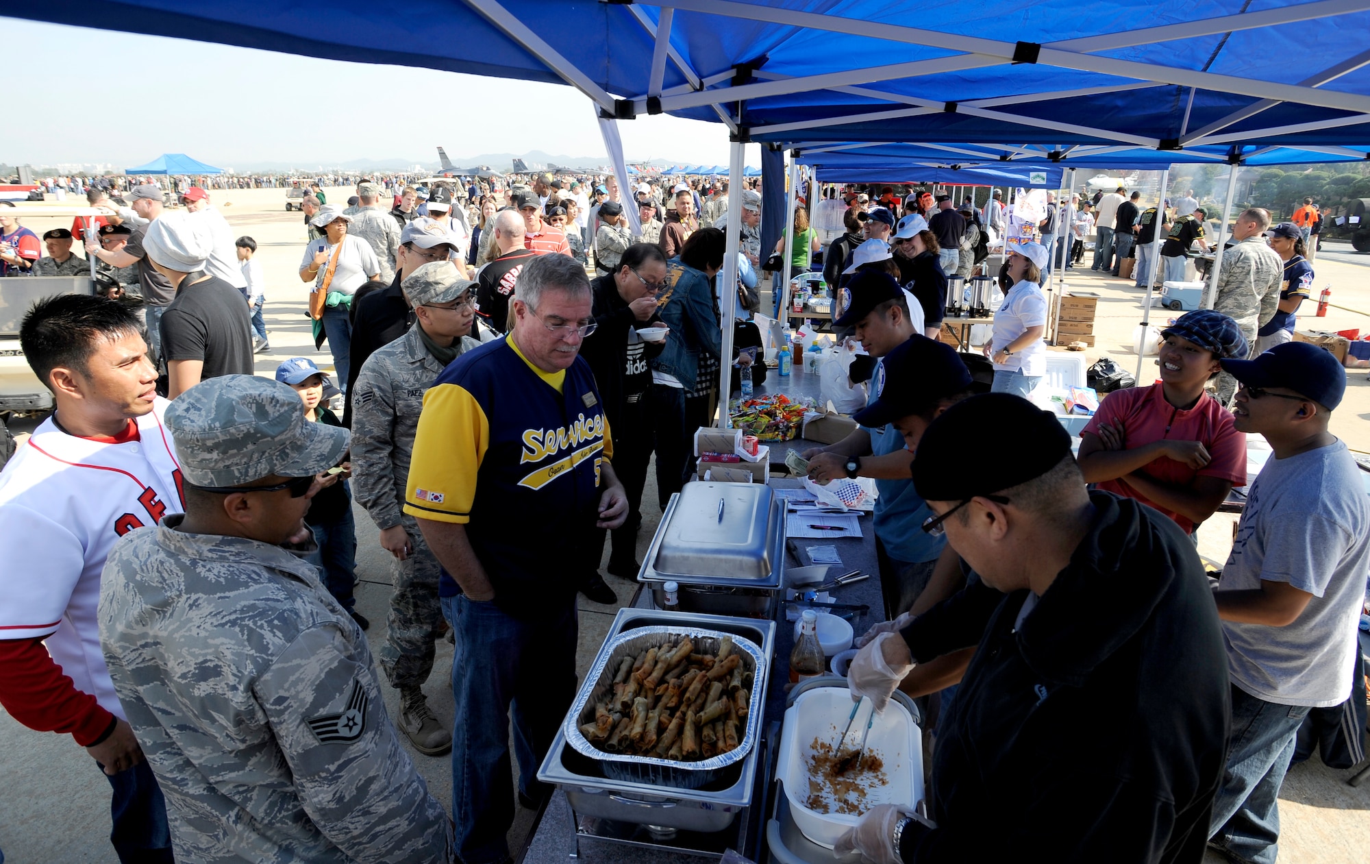 Military and civilian spectators take advantage of the food booths during Air Power Day 2009 at Osan Air Base, Republic of Korea, Oct. 21.(U.S. Air Force photo/Staff Sgt. Brian Ferguson)




