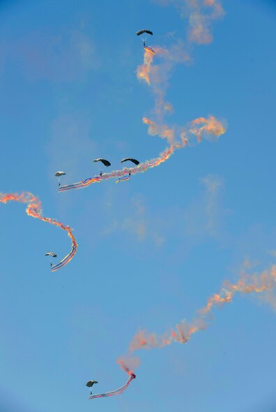 Republic of Korea Air Force Special Operations Forces soldiers parachute to the ground after the playing of the U.S. and Korean National Anthems, Oct. 21. The jump was part of the 2009 Air Power Day events. (U.S. Air Force photo/Staff Sgt. Brian Ferguson)