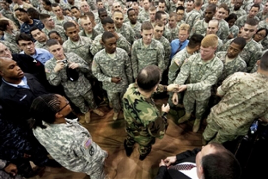 U.S. Navy Adm. Mike Mullen, chairman of the Joint Chiefs of Staff, greets troops during an all-hands call at Collier Field House on U.S. Army Garrison-Yongsan in Seoul, South Korea, Oct. 22, 2009. Mullen, who visited Korea for annual military meetings between the allies, also will travel to Kadena Air Force Base, Okinawa, Japan, to visit troops.