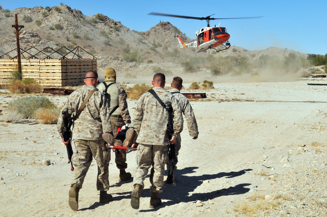 Marines practice an air medical evacuation on the Barry M. Goldwater Range, Oct. 22, 2009, as part of the Corporal’s Course final exercise. This course was hosted at the Marine Corps Air Station in Yuma, Ariz., and was the station’s first Corporal’s Course using the revised curriculum mandated throughout the Corps. The 35 students graduated Oct. 23, 2009. In order to pass, the students here had to master at least seven out of the nine events in the new curriculum.