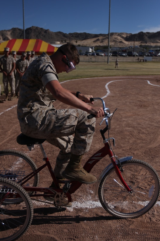 Lance Cpl. Timothy Fowler, a student with Company A, Marine Corps Communications-Electronic School, rides the drunk goggle course at Victory Field during the MCCES Safety Fair Oct. 23.