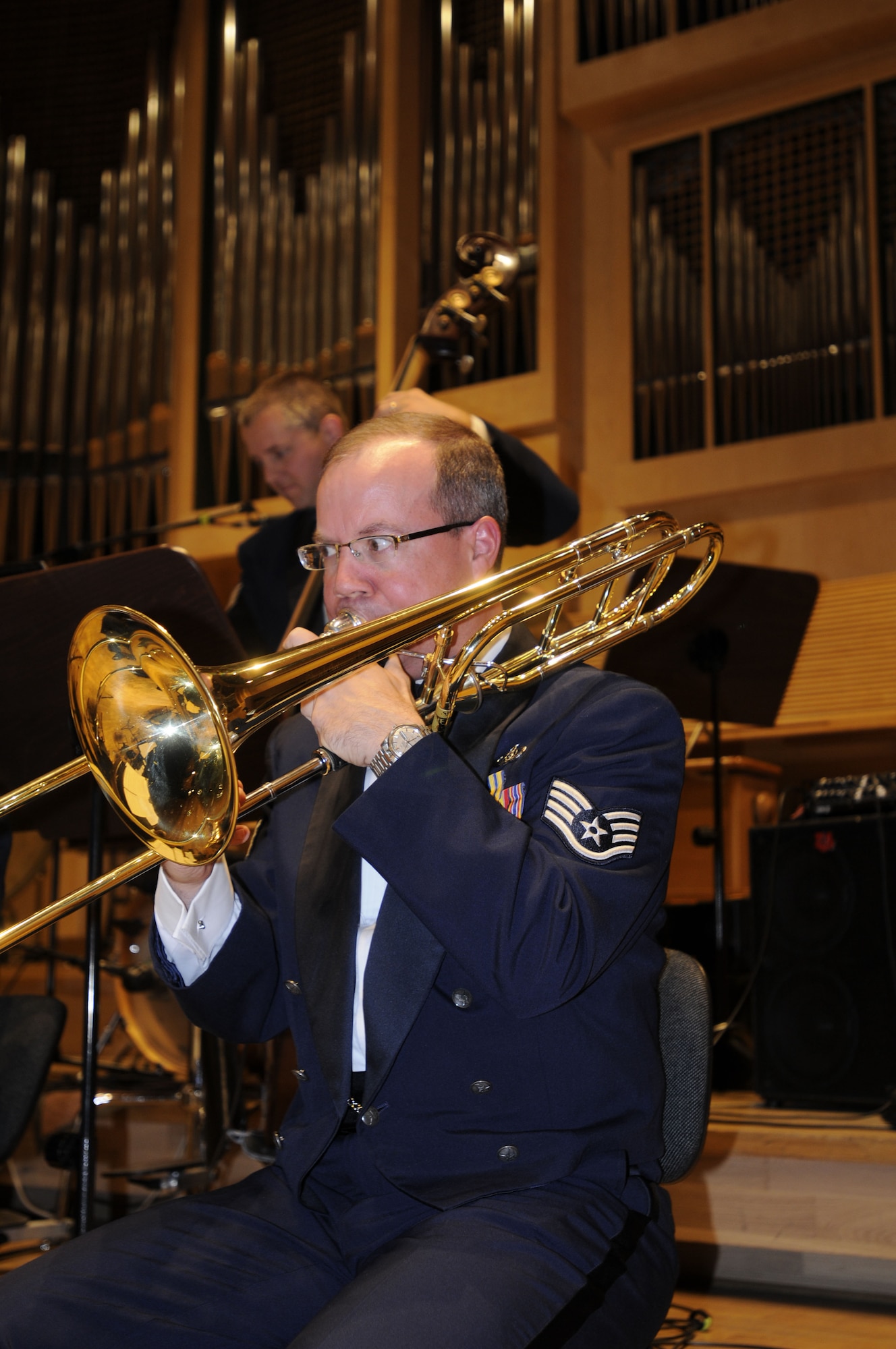 OPOLE, Poland – Staff Sgt. Scott Ruedger, trombone player, performs during the second half of the U.S. Air Forces in Europe Band’s performance at the Filharmonia Opolska im. Jozefa Elsnera here Oct. 21.  The 41-piece band is in Poland to support USAFE Commander Gen. Roger Brady’s international relations program in partnership with the U.S. State Department.  The band is playing six shows in six days Oct. 20-25 to help commemorate 90 years of Polish-American cooperation. (U.S. Air Force photo/Master Sgt. Kelley J. Stewart)