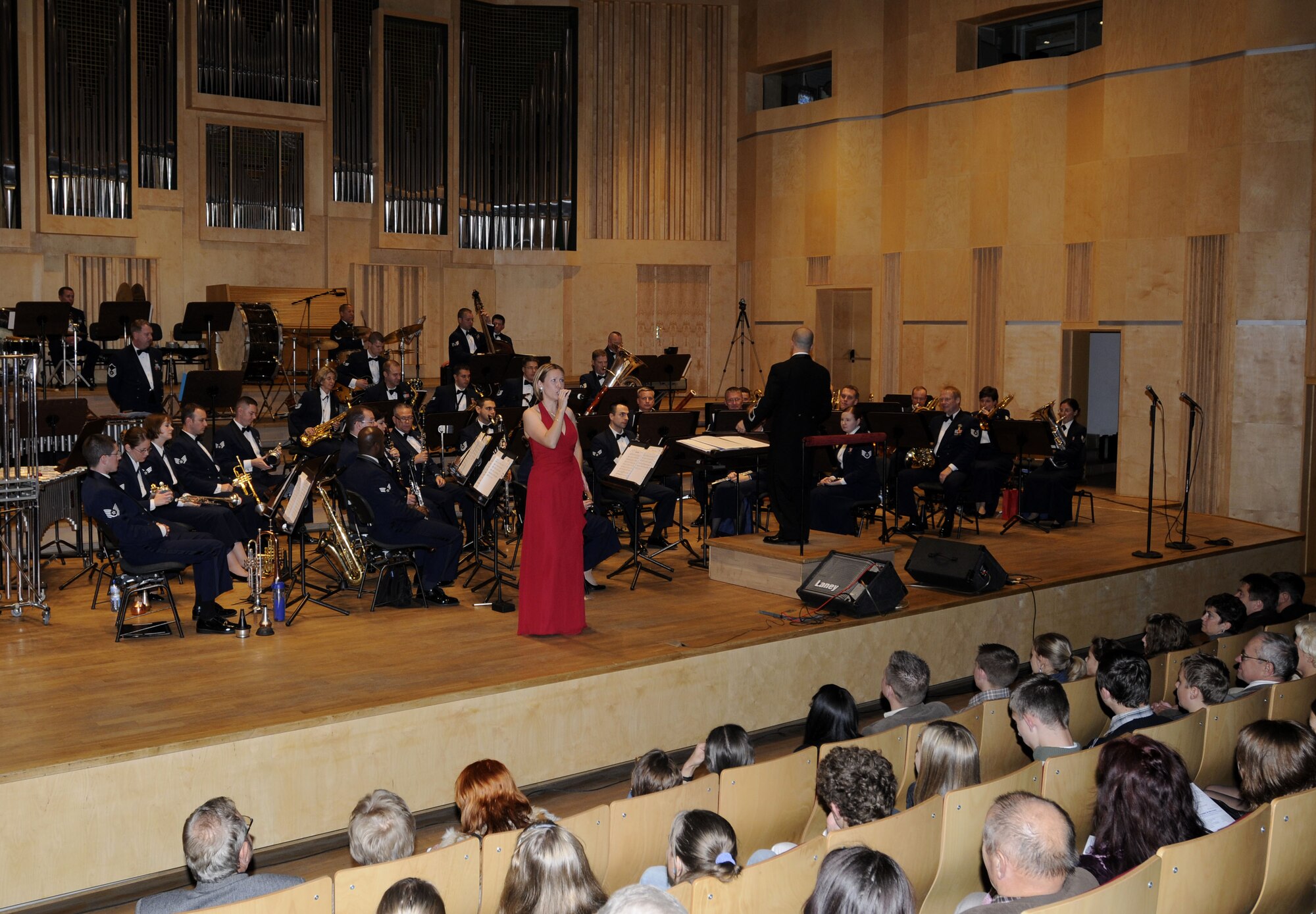 OPOLE, Poland – Staff Sgt. Rachel Trimble, vocalist, since “Cheek to Cheek” during the second half of the U.S. Air Forces in Europe Band’s performance at the Filharmonia Opolska im. Jozefa Elsnera here Oct. 21.  The 41-piece band is in Poland to support USAFE Commander Gen. Roger Brady’s international relations program in partnership with the U.S. State Department.  The band is playing six shows in six days Oct. 20-25 to help commemorate 90 years of Polish-American cooperation. (U.S. Air Force photo/Master Sgt. Kelley J. Stewart)