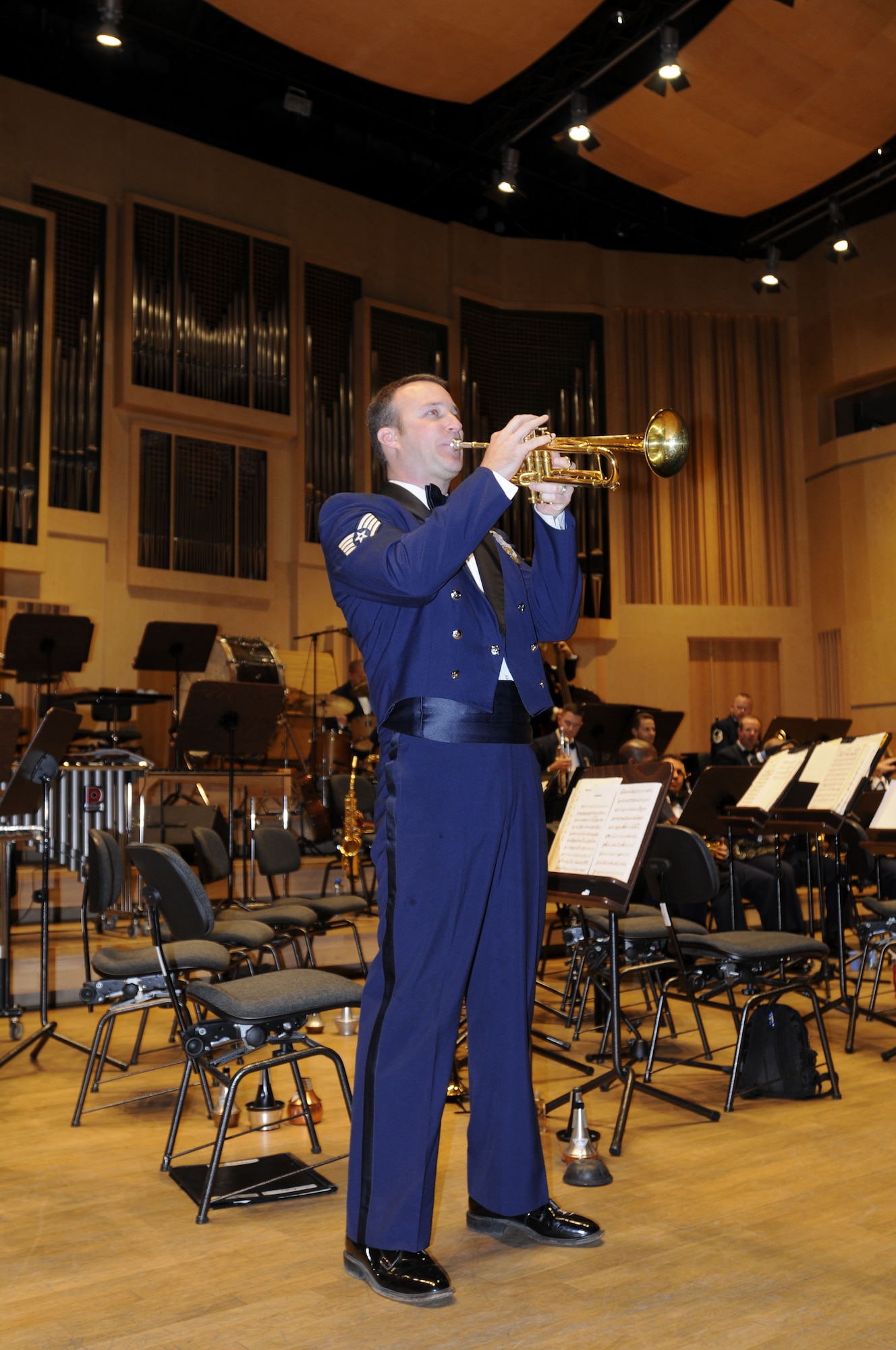 OPOLE, Poland – Staff Sgt. Gene Dooley plays a trumpet solo during “Better than Anything” here Oct. 21 at the U.S. Air Forces in Europe Band’s concert at the Filharmonia Opolska im. Jozefa Elsnera.  The band is in Poland to support USAFE Commander Gen. Roger Brady’s international relations program in partnership with the U.S. State Department.  The 41-piece band is playing six concerts in six days Oct. 20-25 to help commemorate 90 years of Polish-American cooperation.  (U.S. Air Force photo/Master Sgt. Kelley J. Stewart)