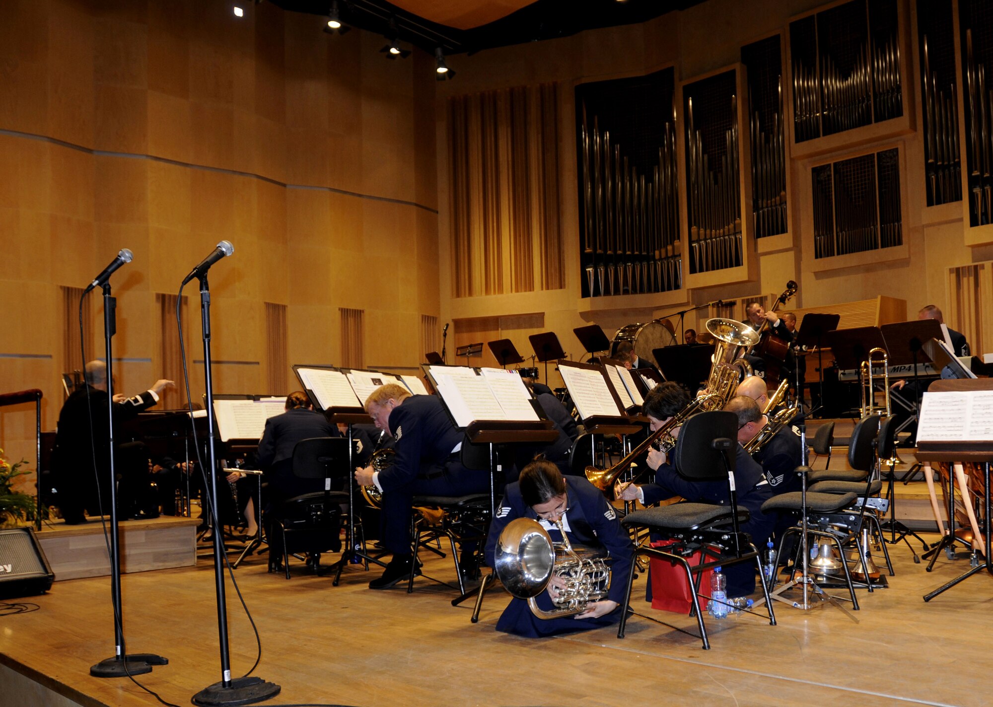 OPOLE, Poland – The U.S. Air Forces in Europe Band crouches down while playing softly during a Glenn Miller medley concert here Oct. 21 at the Filharmonia Opolska im. Jozefa Elsnera.  The band’s performed six concerts in six days Oct. 20-25 around Poland.  The 41-piece band’s concert series is in support of the USAFE Commander Gen. Roger Brady’s international relations program in partnership with the U.S. State Department t help commemorate 90 years of Polish-American cooperation.  (U.S. Air Force photo/Master Sgt. Kelley J. Stewart)