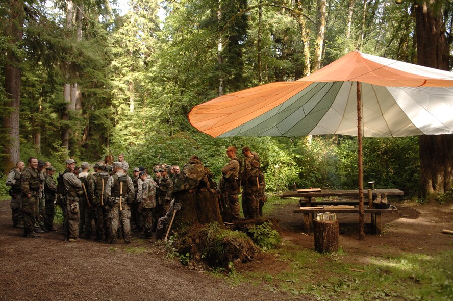 Students gather for instruction next to their fire circle in the Hoh Rainforest in the Olympic National Forest. 