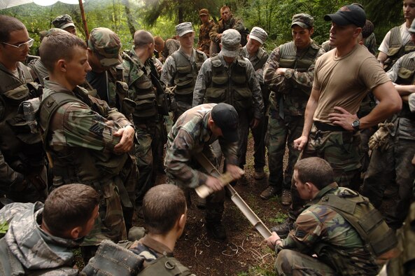 A SERE instructor shows students how to create a fire using bamboo in the Tropics phase of the SERE tech school.