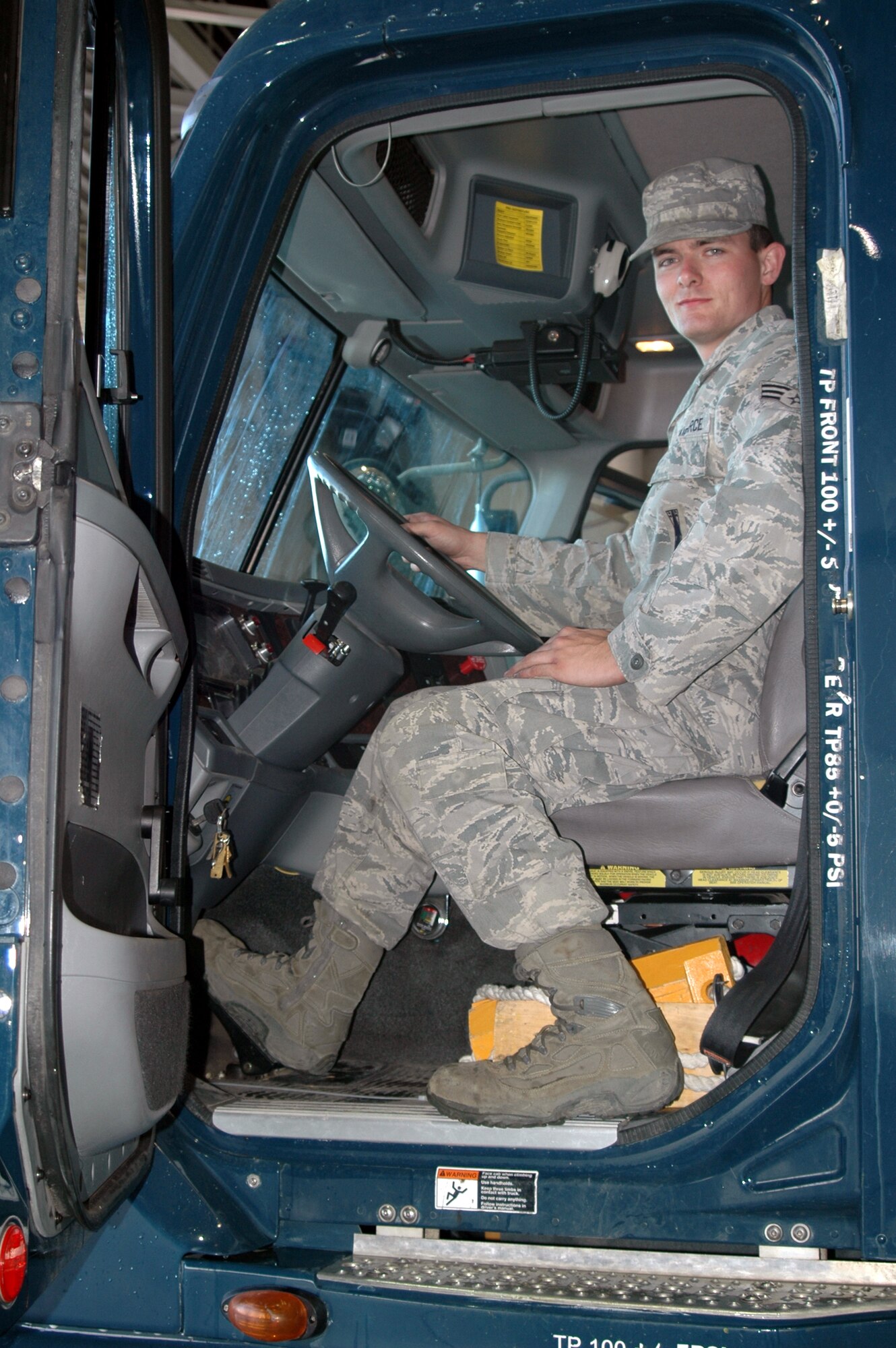 Senior Airman James Broderick, 341st Missile Maintenance Squadron top-sider, pauses for a photo Sept. 22 after backing Payload Transporter van 38 into the 3-Bay Hangar after his 100th incident-free mission to one of the 341st Missile Wing's 150 launch facilities. Airman Broderick has been driving the 80,000 pound PT vans since April, 2006, and can cover up to 300 miles of Malmstrom "flight line" in a day. (U.S. Air Force photo/Senior Airman Dillon White) 