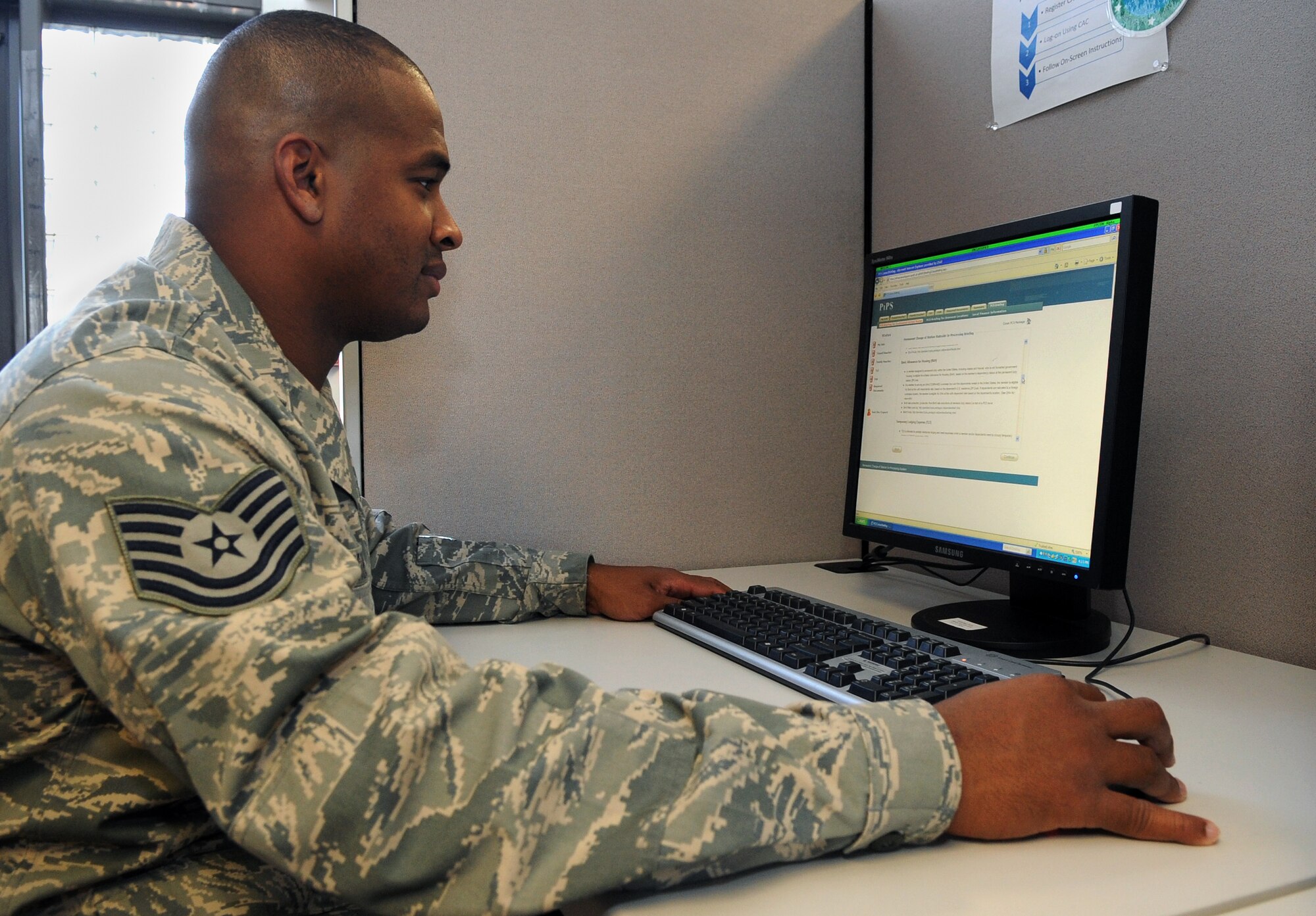 Tech. Sgt. Modesto Martinez, 460th Force Support Squadron, uses the PCS In-processing System at "The Source" at the military personnel flight Oct. 19. "The Source" is Buckley Air Force Base's eFinance self-help center, an all in one station where Airmen can take care of their financial services. (U.S. Air Force photo by Senior Airman John Easterling)