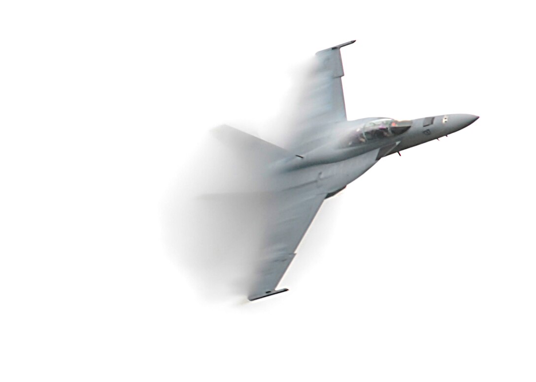 An F/A-18F Super Hornet pushes the limits of the sound barrier Oct. 11 during the second day of Sheppard's 2009 Open House and Air Show. More than 23,000 spectators braved the elements to past and present air power. (U.S. Air Force photo/Harry Tonemah)