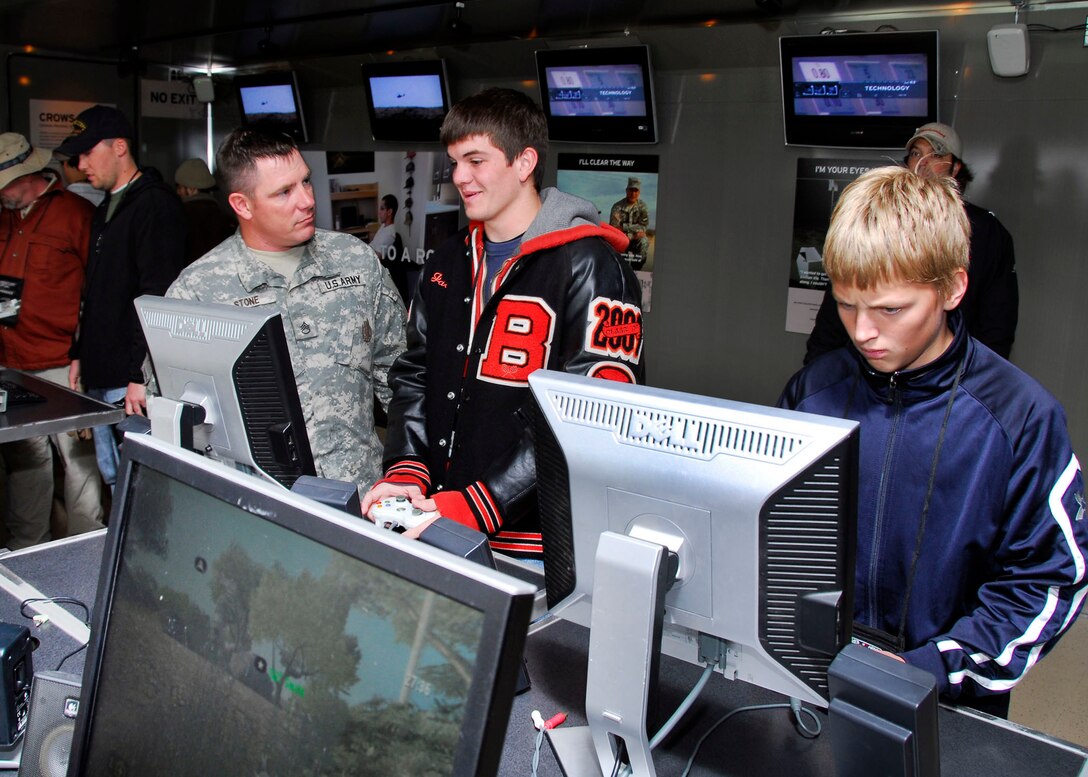 Guests at Sheppard's 2009 Open House and Air Show take a look at various technologies used to train today's Air Force Airmen at the 82nd Training Wing Training Operations Technology display Oct. 11. The tent housed everything from animated computer training to explosive ordnance disposal robots used in places such as Afghanistan and Iraq. (U.S. Air Force photo/Harry Tonemah)