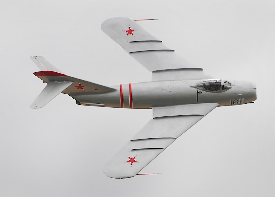 Randy Ball steers his MiG-17F above spectators Oct. 10 during Sheppard's 2009 Open House and Air Show. The MiG-17 is capable reaching speeds close to 700 mph and can inflict eight times the force of gravity on those flying it. (U.S. Air Force photo/Harry Tonemah)
