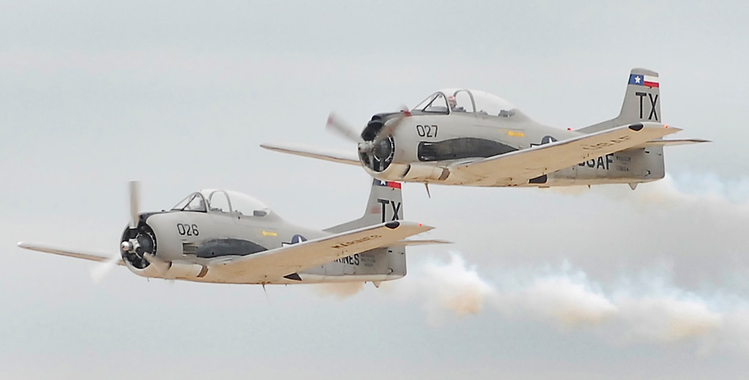 The Trojan Phlyers Aerobatic Team flies in tight formation Oct. 10 during Sheppard's 2009 Open House and Air Show. The T-28B Trojan performance was one of many during the base's two-day show. (U.S. Air Force photo/Harry Tonemah)
