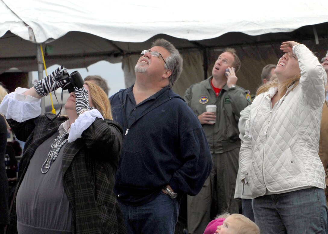 Spectators look to the skies Oct. 10 during Sheppard's 2009 Open House and Air Show. Despite poor weather conditions, more than 23,000 guests turned out to see the past and present of military aviation as well as a few civilian acts. (U.S. Air Force photo/Harry Tonemah)