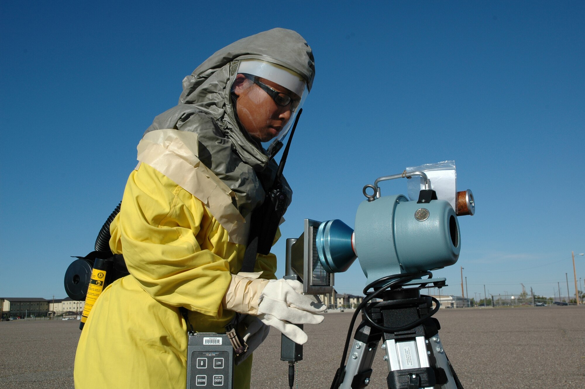 Airman 1st Class Michelle Smith, 341st Medical Operations Squadron bioenvironmental apprentice, simulates checking for Alpha particles collected by an instrument that collects airborne contaminates during a Response Task Force exercise Oct. 2, 2009, on the flight line. (U.S. Air Force photo/Senior Airman Dillon White)