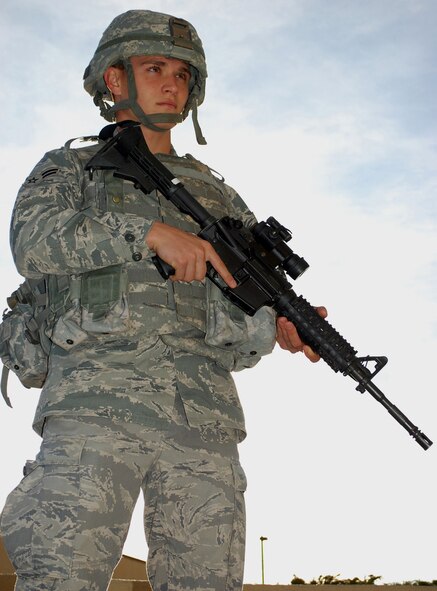 Airman 1st Class Josef Kelm, 741st Missile Security Forces Squadron Escort Team member, pauses for a photograph in full gear on Oct.16, 2009. The 741st Missile Security Forces Squadron organizes, trains, and equips the Airmen responsible for providing security for one the nation’s top assets. (U.S. Air Force photo/Airman 1st Class Kristina Overton)