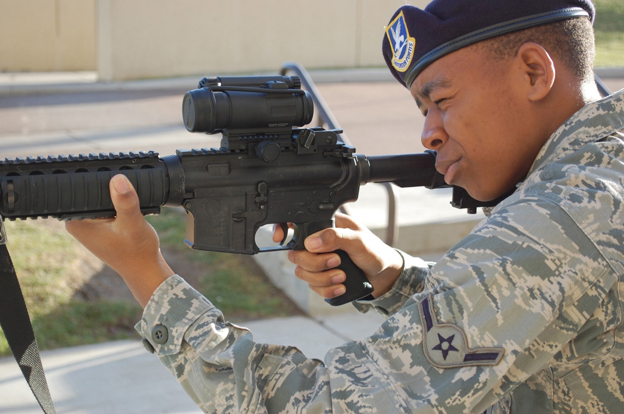 Airman James Stewart, 741st Missile Security Forces Squadron Escort Team member, demonstrates the proper handling technique for an M-4 carbine Oct. 16, 2009. The Security Forces Escort Team provides security for missile maintenance personnel. (U.S. Air Force photo/Airman 1st Class Kristina Overton)
