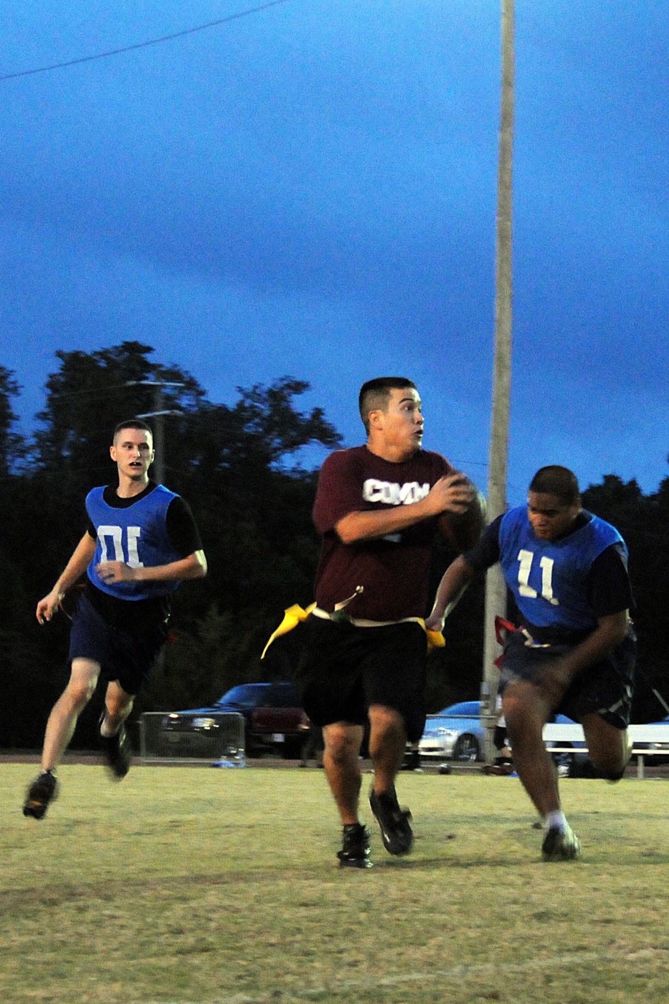 EGLIN AIR FORCE BASE, Fla. – John Haraguchi, 96th Communications Group quarterback, scrambles out of the pocket searching for an open wide receiver during an Intramural Flag Football matchup, Oct. 22. The 308th team beat the 96th Comm team 23-18 in a nail-biting contest which came down to the final seconds of the game. Games are played every Tuesday and Thursday at the East Gate track beginning at 5:30 p.m. (U.S. Air Force photo/Airman Anthony Jennings)