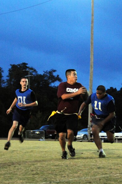 EGLIN AIR FORCE BASE, Fla. – John Haraguchi, 96th Communications Group quarterback, scrambles out of the pocket searching for an open wide receiver during an Intramural Flag Football matchup, Oct. 22. The 308th team beat the 96th Comm team 23-18 in a nail-biting contest which came down to the final seconds of the game. Games are played every Tuesday and Thursday at the East Gate track beginning at 5:30 p.m. (U.S. Air Force photo/Airman Anthony Jennings)