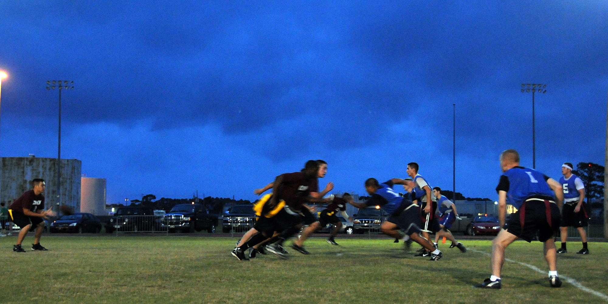 EGLIN AIR FORCE BASE, Fla. –  The 96th Communications Group battles against the 308th Armament Systems Wing during an Intramural Flag Football matchup, Oct. 22. The 308th team beat the 96th Comm team 23-18 in a nail-biting contest which came down to the final seconds of the game. Games are played every Tuesday and Thursday at the East Gate track beginning at 5:30 p.m. (U.S. Air Force photo/Airman Anthony Jennings)