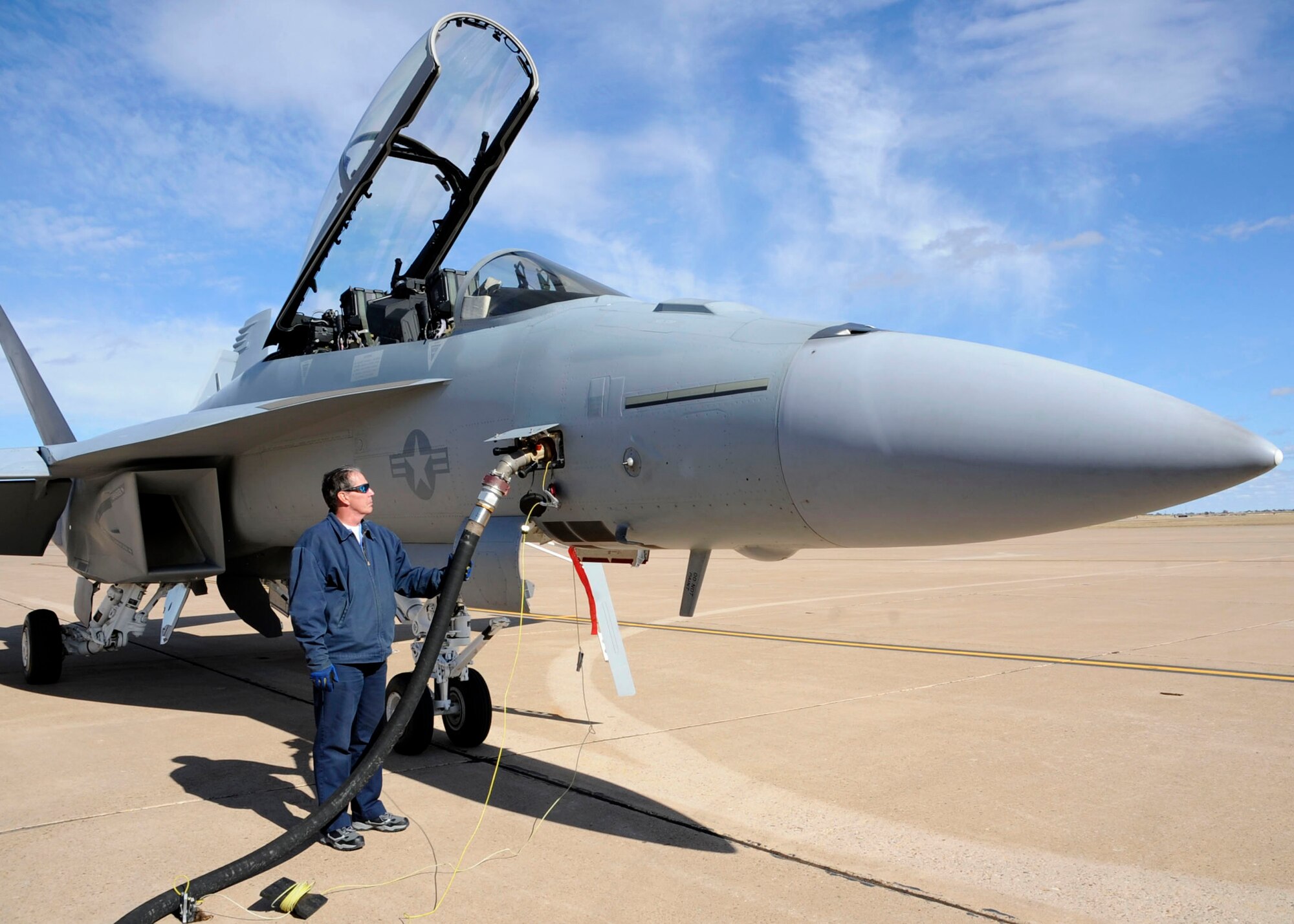 CANNON AIR FORCE BASE, N.M.--  Carl Bonness, 27th Special Operations Maintenance Squadron, watches the meter as he refuels a Naval F/A18F Hornet that flew in  Oct. 22. Depending on the model, F/A-18's can take from 1,600 to 2,200 gallons of fuel in one sitting. (U.S. Air Force photo by Airman 1st Class Maynelinne De La Cruz) 