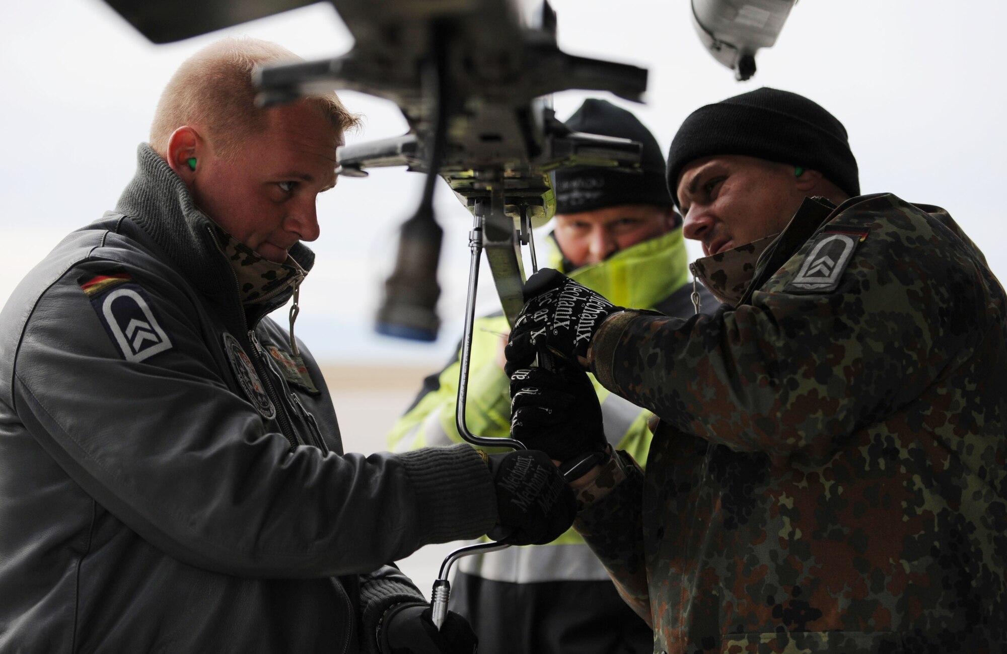 MOUNTAIN HOME AIR FORCE BASE, Idaho-- Left, Tech. Sgt. Torsten Naujoks and Tech. Sgt. Fabian Schoor, German Air Force Flying and Training Center first line maintenance crew chiefs, out of Holloman AFB, N.M., perform post flight maintenance on a PA-200 Tornado during Mountain Roundup Oct. 21. Mountain Roundup is a large-force exercise running from Oct. 15 through Oct. 30 and includes participants from the German air force, U.S. Air Force, U.S. Navy and U.S. Marine Corps. (U.S. Air Force photo by Airman 1st Class Renishia Richardson) 