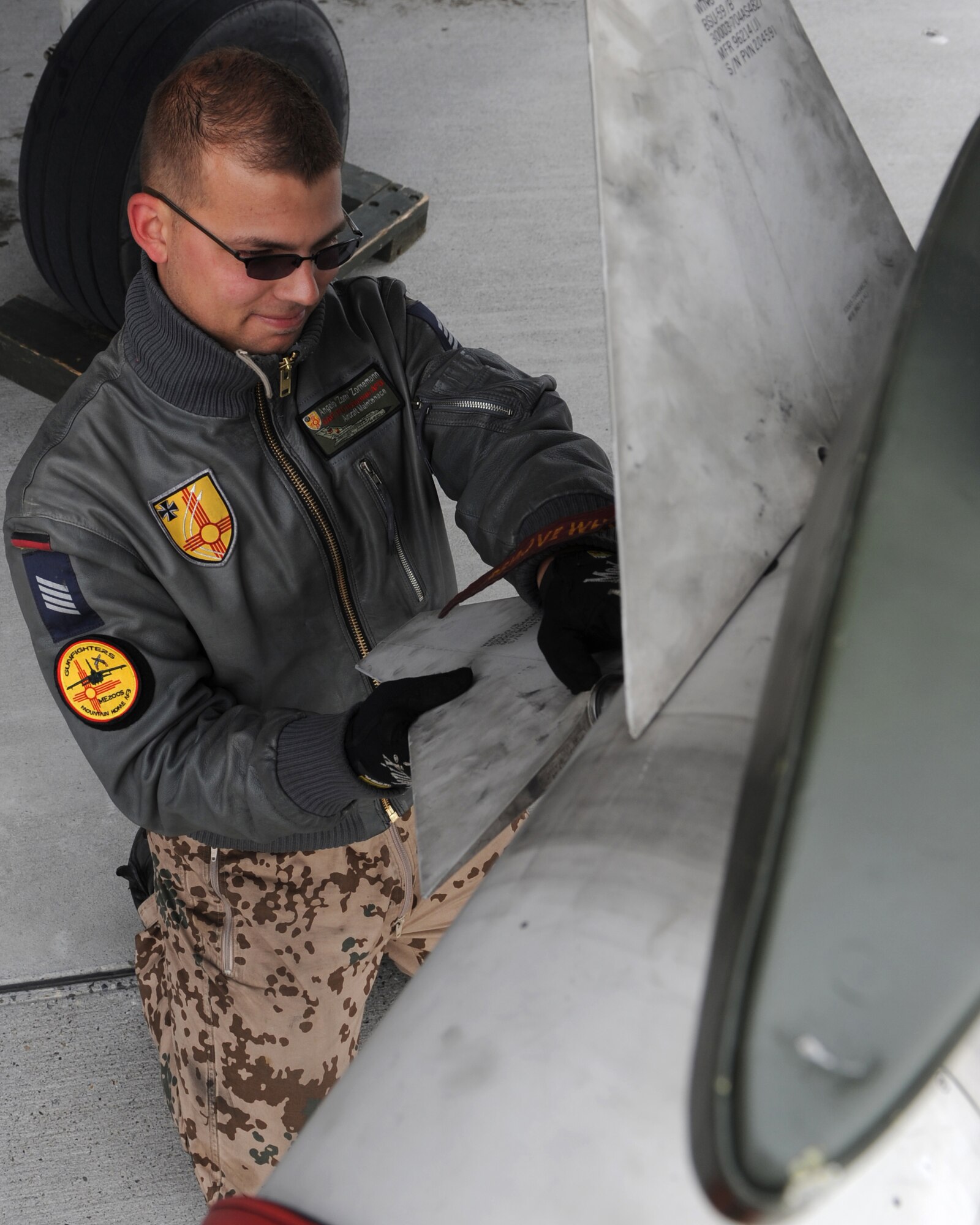 MOUNTAIN HOME AIR FORCE BASE, Idaho --  Senior Airman Angelo Zornemann, German Air Force Flying and Training Center maintenance journeyman, out of Holloman AFB, N.M., attaches a fin to an AIM-9 sidewinder missile during Mountain Roundup Oct. 21.  Mountain Roundup is a large-force exercise running from Oct. 15 through Oct. 30 and includes participants from the German air force, U.S. Air Force, U.S. Navy and U.S. Marine Corps. (U.S. Air Force photo by Airman 1st Class Debbie Lockhart)