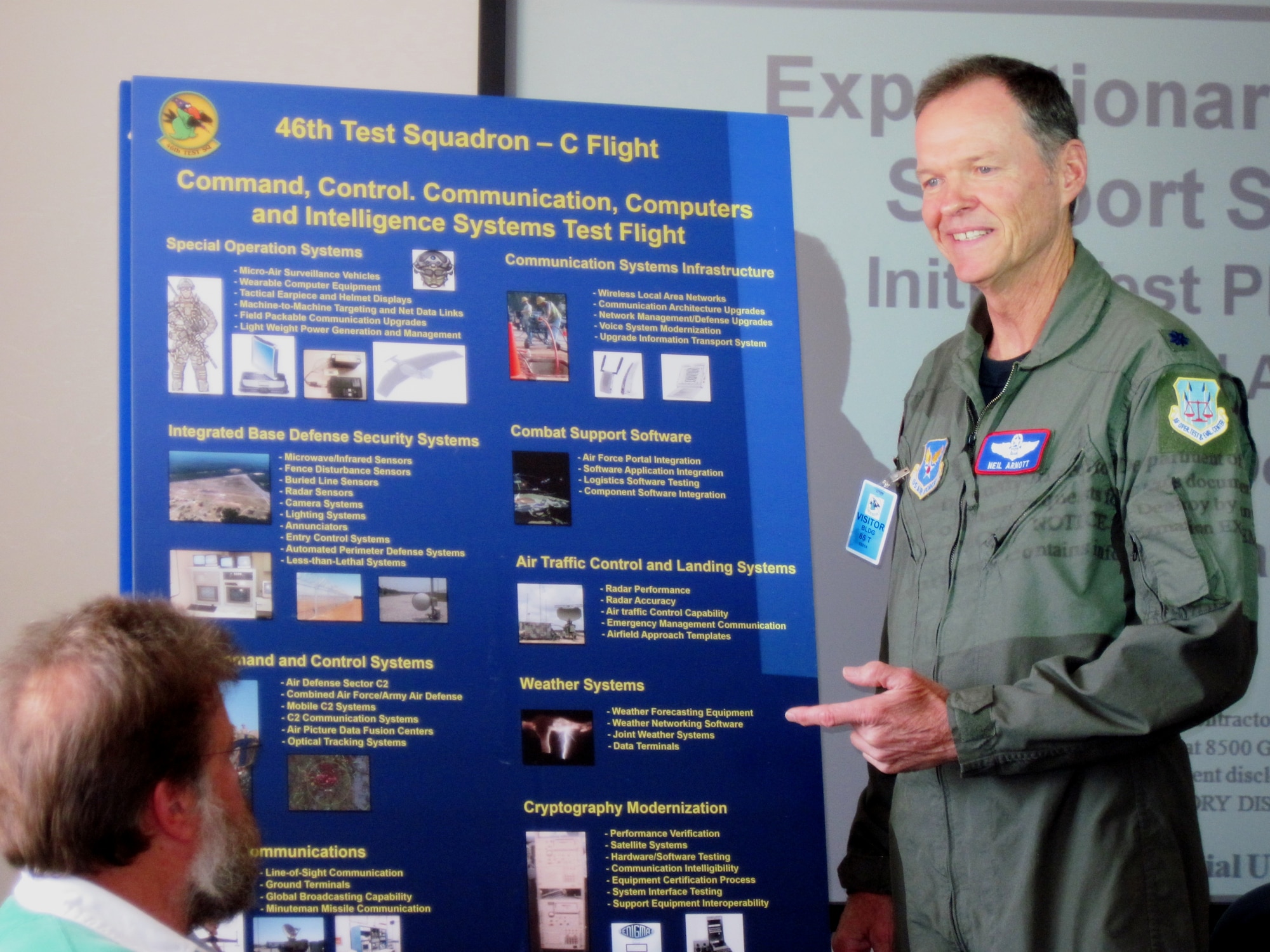 Lt. Col. Neil Arnott, test director for the Air Force Operational and Test Evaluation Center, briefs his staff during a meeting. The colonel volunteered to come back to the active duty Air Force, under the service's new Retired Rated Officer Recall Program, after retiring here in 1993 . (U.S. Air Force photo/Minty Knighton)