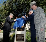 Gen. Stephen Lorenz, Air Education and Training Command commander, looks on as former Randolph Air Force Base cadets, Maj. Gen. (retired) William Acker, left, and Col. (retired) Donald Robison, unveil the plaque at the Cadet Circle dedication ceremony in the AETC circle drive. The circular courtyard between the AETC headquarters building and the command’s Lahm Conference Center was named Cadet Circle today to honor more than 16,000 aviation cadets and student pilots who received their pilot training here.  The Army Air Corps Aviation Cadet Program began during World War I and was conducted at Randolph from 1931 to 1965.  In 1943 the mission here changed when the Central Instructor's School moved to Randolph. In 1947 the cadets came back along with basic flying training and remained here until cadet training was phased out at Randolph in 1951. The new monument, centered in the middle of the courtyard, honors the men who were the primary reason for the existence of the base itself—cadets who lived, trained, and in some cases, died at Randolph. (U.S. Air Force/ Rich McFadden) 