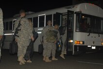 HICKAM AIR FORCE BASE, Hawaii -- Troops from the 25th Infantry Division
out of Schofield Barracks board a bus after a long flight home Oct. 23. More than 143 troops flew into Hickam's flightline and 735th Air Mobility Squadron passenger terminal here upon return from Iraq, where they were deployed for more than 12 months in support of Operation Iraqi Freedom. The 735th AMS is an Air Mobility Command tenant unit here, supporting airlift movement of people and passengers around the world. In the last year, the 735th AMS has assisted in transporting 11,077 personnel on 72 missions for the Army's 25th ID; 2,518 personnel on 16 missions from
the Kaneohe Marine Corps Base, Hawaii; and 5,720 other personnel on 50 missions in support of Operations Iraqi and Enduring Freedom. (U.S. Air Force photo/Senior Airman Gustavo Gonzalez)
