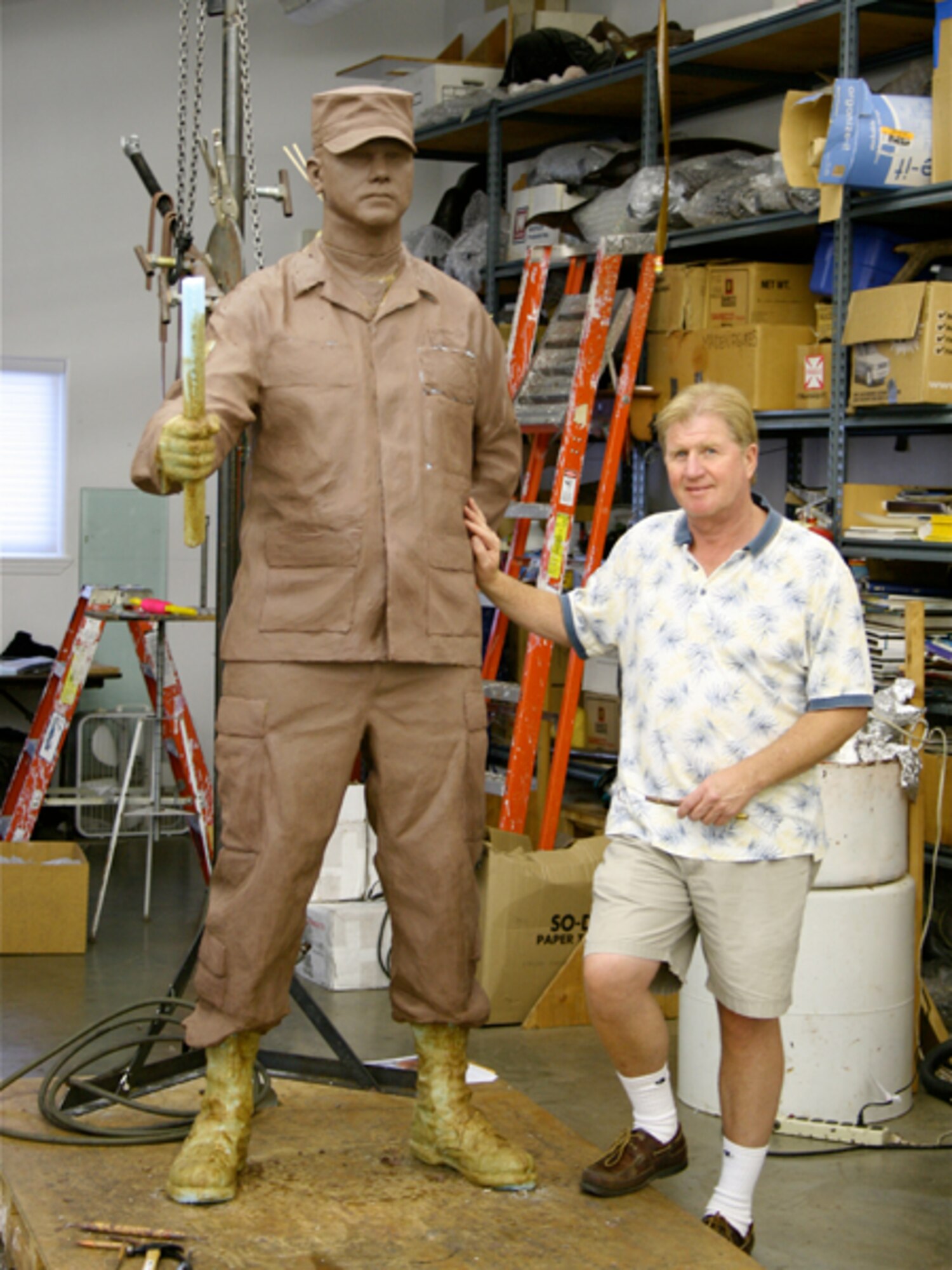 Michael Maiden, sculptor, works on the yet unfinished male first sergeant statue at his studio in Oregon. For the finished memorial, this statue will be joined by a female first sergeant statue and located at the Enlisted Heritage Hall museum at Gunter Air Force Base, Al. (Courtesy Photo)