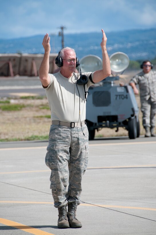 U.S. Air Force Chief Master Sgt. Robert Hanes marshals an F-16 Fighting Falcon aircraft at Hickam Air Force Base, Hawaii, Sept. 11, 2009. The aircraft is with the California Air National Guard's 144th Fighter Wing and is participating in Sentry Aloha. Sentry Aloha is an exercise that brings dissimilar combat assets to Hickam to train with the Hawaii Air National Guard's 199th Fighter Squadron. (U.S. Air Force photo by Staff Sgt. Charles P. Vaughn) (Released)

