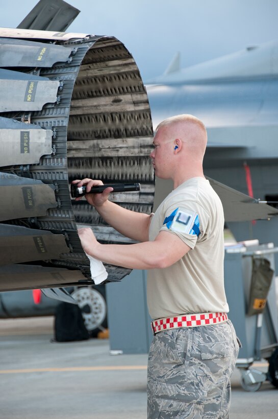 U.S. Air Force Technical Sgt. Severin Koerner, a crew chief with the 144th Aircraft Maintenance Squadron, inspects the exhaust of an F-16 Fighting Falcon during a pre-flight inspection while at Sentry Aloha on Sept. 8, 2009. Sentry Aloha is an exercise that brings disimilar combat assets to Hickam to train with the Hawaii National Guard. (U.S. Air Force photo by Staff Sgt. Charles P. Vaughn) (Released)