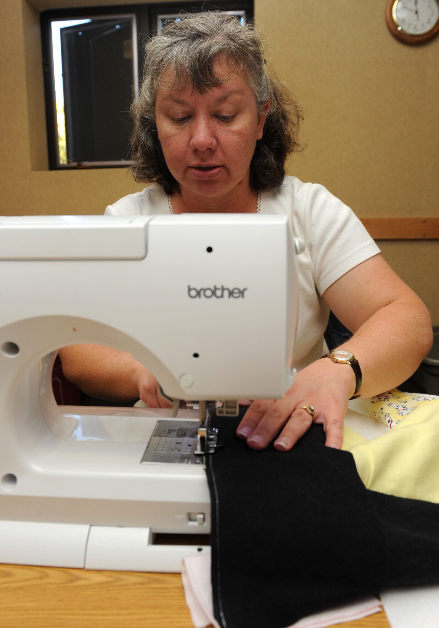 MOUNTAIN HOME AIR FORCE BASE, Idaho -- Danakee Nelson, Hammond Baby Bundles volunteer, sews together fabric to make a quilt during Hammond Quilt Day Oct. 17 at the Airman and Family Readiness Center. Volunteers assembled more than two dozen quilts to donate to families with newborn babies at the 366th Medical Group Family Care Unit. Hammond Quilt Day began in 2004 to honor the memory of Airman 1st Class Walter James Hammond IV, who was an avid volunteer. (U.S. Air Force photo by Airman 1st Class Debbie Lockhart)
