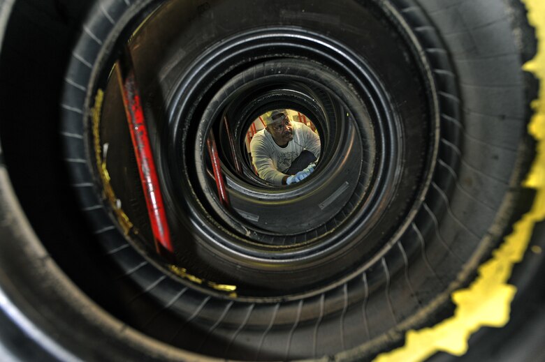OFFUTT AIR FORCE BASE, Neb. - Bobby Nelson, an aircraft technician in the 55th Maintenance Squadron's isochronal phase inspection dock, inspects a tire in the wheel and tire shop here Oct. 15. In addition to working in the ISO dock in the Bennie Davis Maintenance Facility, the approximately 40 aircraft mechanics also man the wheel and tire back shop as necessary.  Each year they process about 400 wheels and tires for the C-135 variant and E-4B aircraft assigned here.

U.S. Air Force photo by Charles Haymond