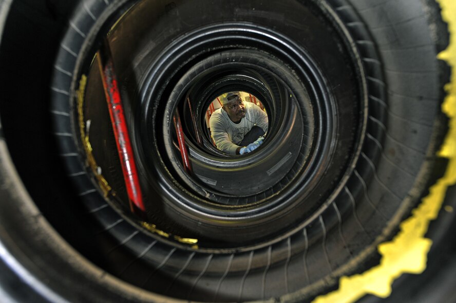 OFFUTT AIR FORCE BASE, Neb. - Bobby Nelson, an aircraft technician in the 55th Maintenance Squadron's isochronal phase inspection dock, inspects a tire in the wheel and tire shop here Oct. 15. In addition to working in the ISO dock in the Bennie Davis Maintenance Facility, the approximately 40 aircraft mechanics also man the wheel and tire back shop as necessary.  Each year they process about 400 wheels and tires for the C-135 variant and E-4B aircraft assigned here.

U.S. Air Force photo by Charles Haymond