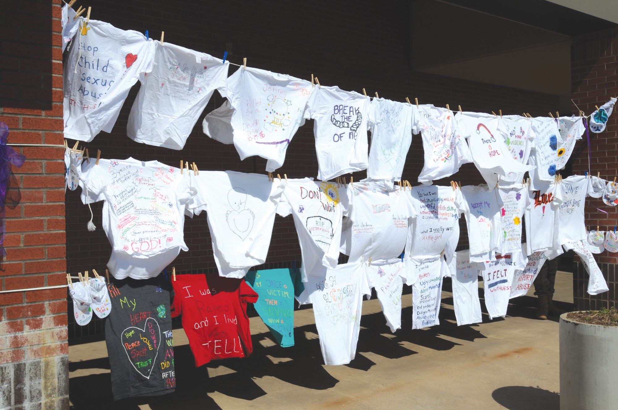 The Clothesline Project display in front of the Goodfellow Commissary, Oct. 20.  The Clothesline Project began in 1990 to raise awareness of domestic violence.  (U.S. Air Force photo by Airman Clayton Lenhardt) 
