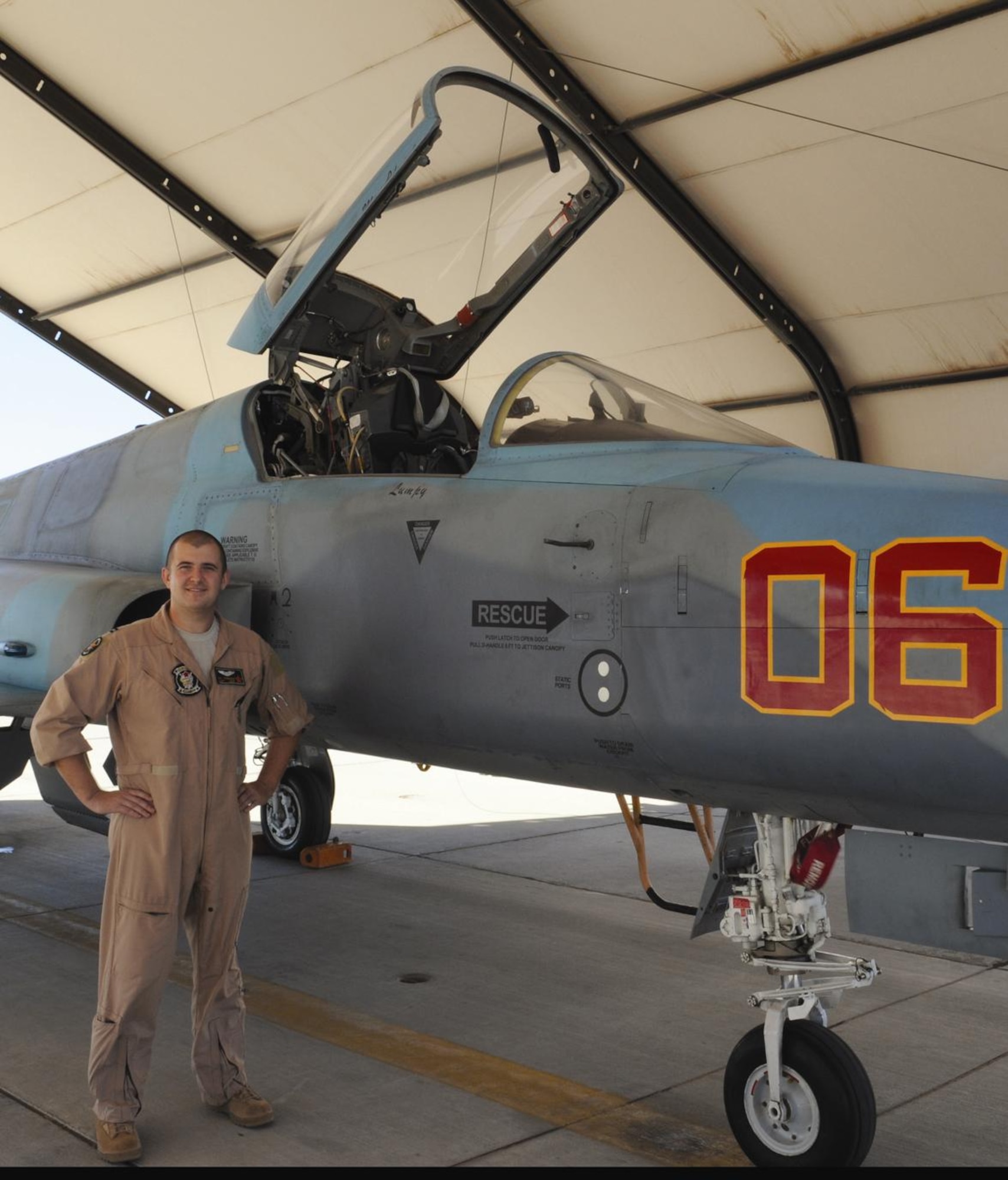 MCAS YUMA, Ariz. -- Air Force Capt. Ryan Corrigan, an exchange pilot, stands next to an F-5N Tiger II of Marine Fighter Training Squadron 401 on the flight line Oct. 15. The two-year program is highly competitive among Air Force pilots and affords them the opportunity to train in the various types of air-to-ground operations Marine pilots fly. (U.S. Marine Corps photo/Lance Cpl. Aaron Diamant)
