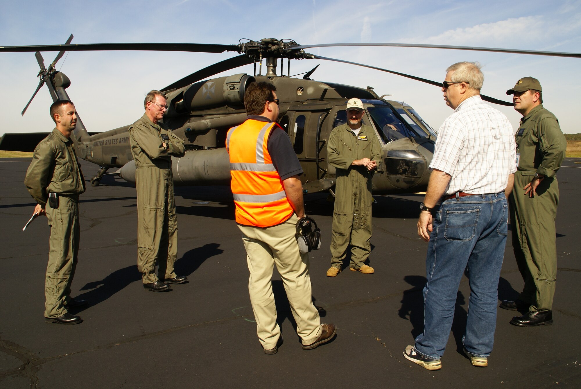 Arnold Engineering Development Center’s (AEDC) Murray King and Rick Hoots (second and fourth from right) welcomed Redstone Test and Training Center (RTTC) Senior Operations Coordinator Pete Santorelli, Tyonek Services Corp., pilots Bill Warren and Daryl Hawkins and RTTC Deputy Director Keith Darrow to Arnold AFB Oct. 21. Hawkins landed the party in an Army UH-60H Blackhawk helicopter at the base’s airfield. AEDC hosted the site visit from the RTTC representatives to discuss the possibility of conducting an undetermined amount of helicopter flight testing at Arnold’s airfield over the next few years. According to King, the Flight Systems Assets Manager at Arnold, the discussions were only preliminary at this point in time. He said the RTTC is interested in AEDC as one of several outlying areas they might use as the flight test mission is moved from Fort Rucker to Redstone [Ala.] as part of a Base Realignment and Closure (BRAC) initiative. (Photo by Philip Lorenz III) 