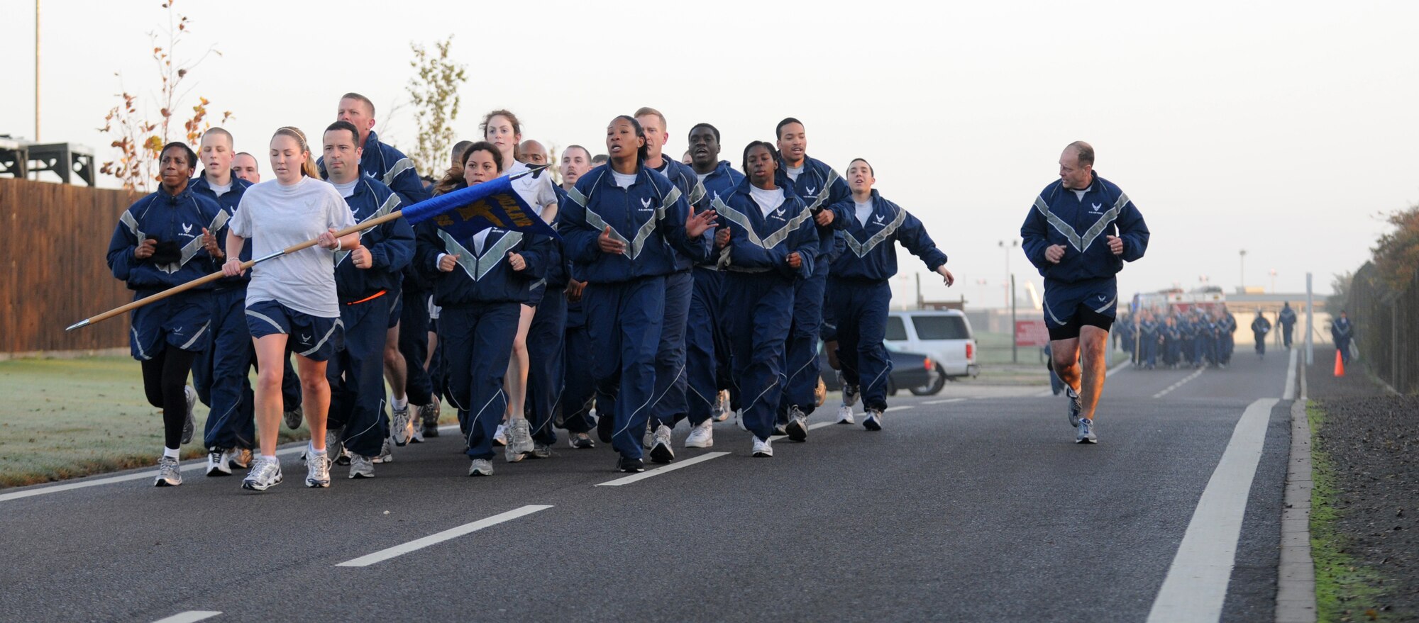 RAF MILDENHALL, England – Maj. Kenneth Dewlen, 100th Force Support Squadron commander, calls out jodies to his formation during the “Where Eagles Dare” Team Mildenhall Run on South Perimeter Road Oct. 23. (U.S. Air Force Photo/ Staff Sgt. Jerry Fleshman)