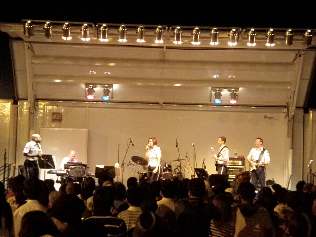 SrA Andrew Jones pumps up the crowd during his final performance with Pacific Trends at the Yokota AB Friendship Festival.  Over 175,000 people attended the festival over the two day period which ended with Pacific Trends performing just before the spectacular fireworks finale. There were over 35 different performances by Japanese and American bands and performers.  This event is open to the general public every year and offers a wide array of things for the public to enjoy, while making new friends.  23 August 09 (photo bt SMSgt Michael Goetz)