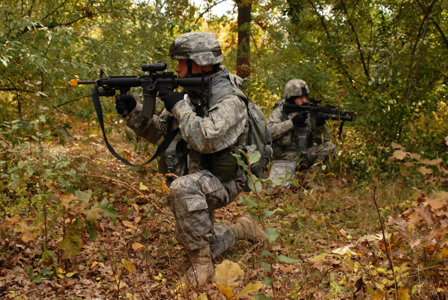 U.S. Air Force Security Forces search the woods for a simulated enemy during an Operational Readiness Exercise at the 180th Fighter Wing, October 17, 2009.  Security Force?s mission was to capture an enemy informant. (U.S. Air Force photo by Airman 1st Class Amber Williams/Released)