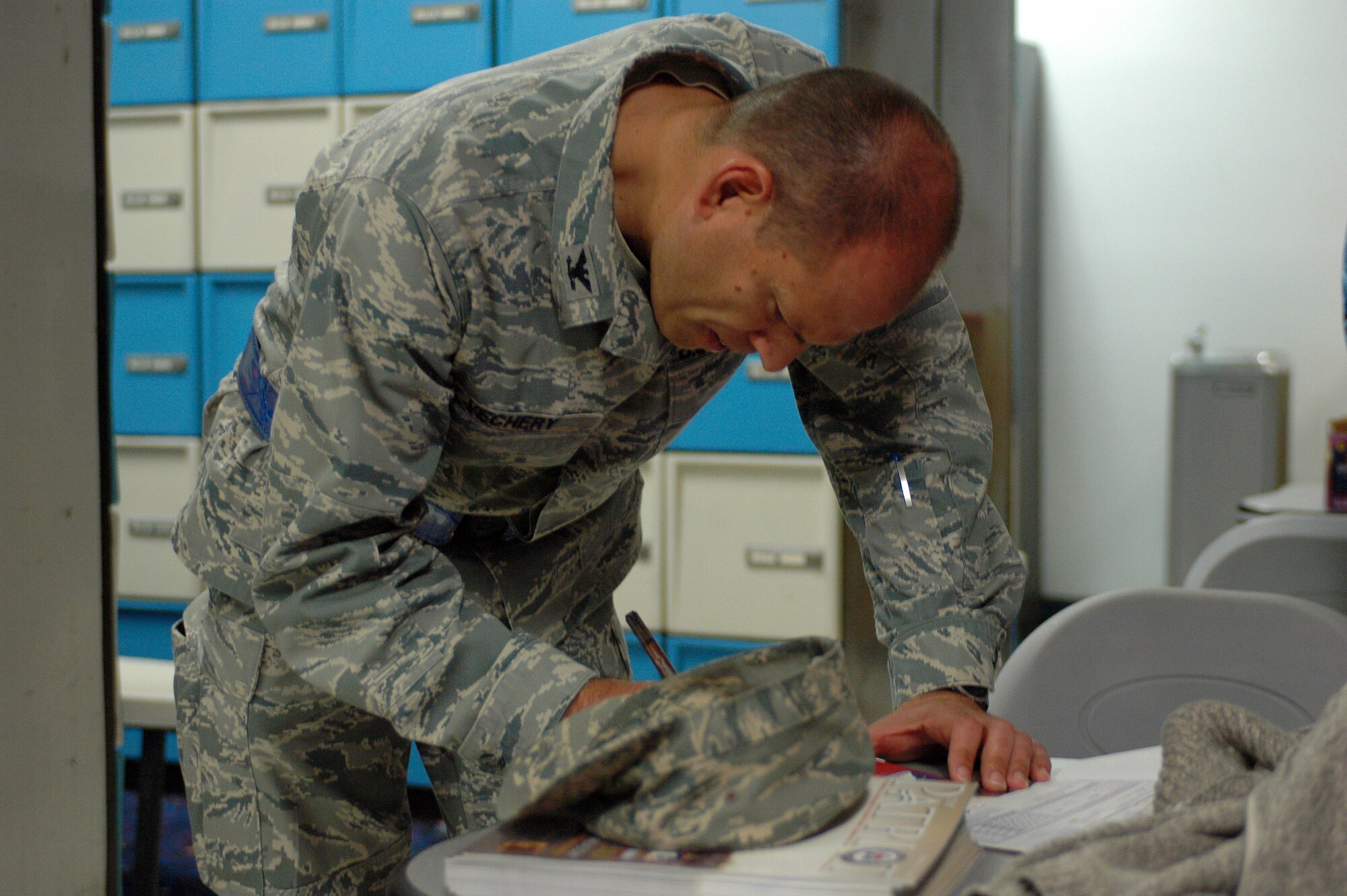 Col. Jim Vechery, 60th Air Mobility Wing commander, signs his Combined Federal Campaign forms Oct. 20 at the kickoff event (U.S. Air Force photo/Nick DeCicco)