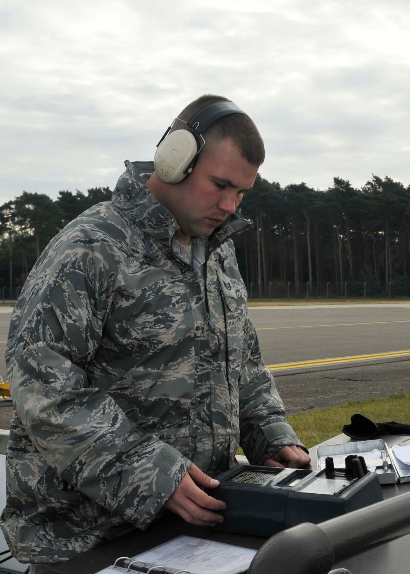 Staff Sgt. Jason Jumonville, 48th Logistics Readiness Squadron fuels distribution technician, checks the electronic gas meter for a print receipt on the amount of fuel distributed to aircraft at RAF Lakenheath, England Oct. 13. The wireless meter system is an efficient way to get the inventory information to the computer. (U.S. Air Force photo/ Airman 1st Class Eboni Knox)