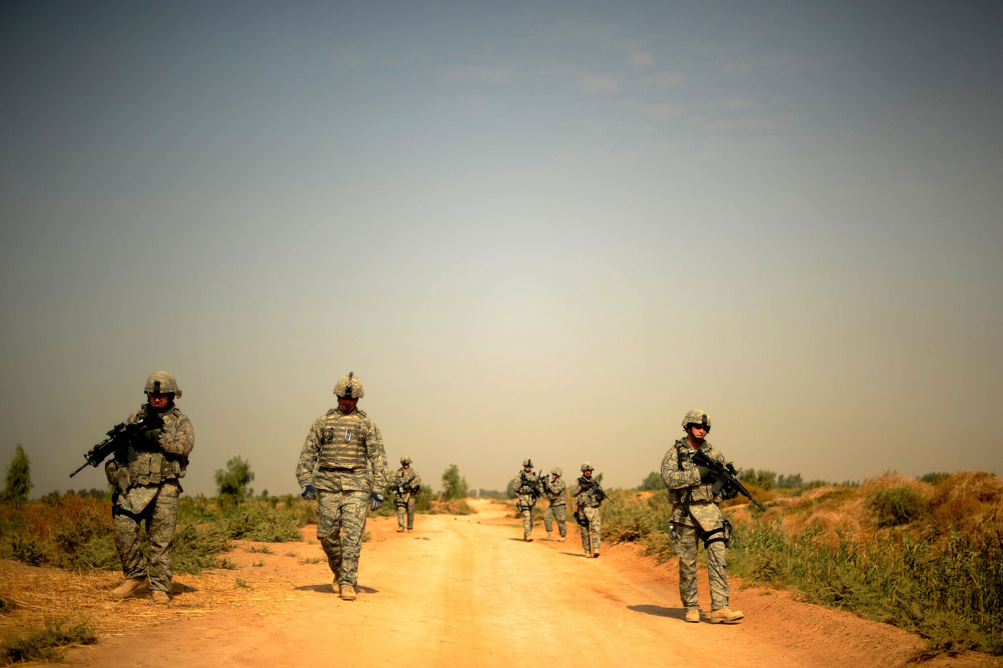 JOINT BASE BALAD, Iraq -- "Lion Team" Airmen from the 532nd Expeditionary Security Forces Squadron return to their vehicles during a force protection patrol outside the base Oct. 17, 2009. The 532nd ESFS patrols outside JBB to provide a security presence intended to deter anyone who would do harm to the people who live and work here. (U.S. Air Force photo/Staff Sgt. Michael B. Keller)