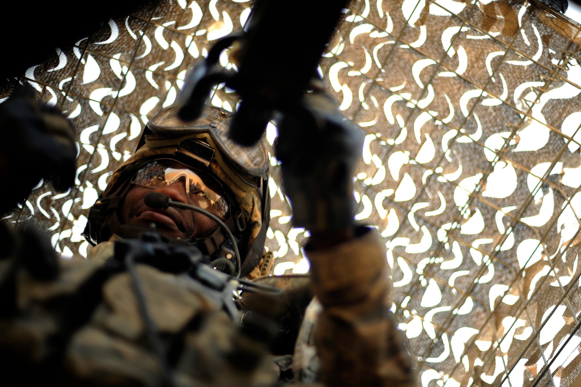 JOINT BASE BALAD, Iraq -- Senior Airman Patrick Kelly of the 532nd Expeditionary Security Forces Squadron test fires his .50 caliber machine gun prior to a Force protection patrol outside the base Oct. 17, 2009. The 532nd ESFS patrols outside JBB to provide a security presence intended to deter anyone who would do harm to the people who live and work here. (U.S. Air Force photo/Staff Sgt. Michael B. Keller)